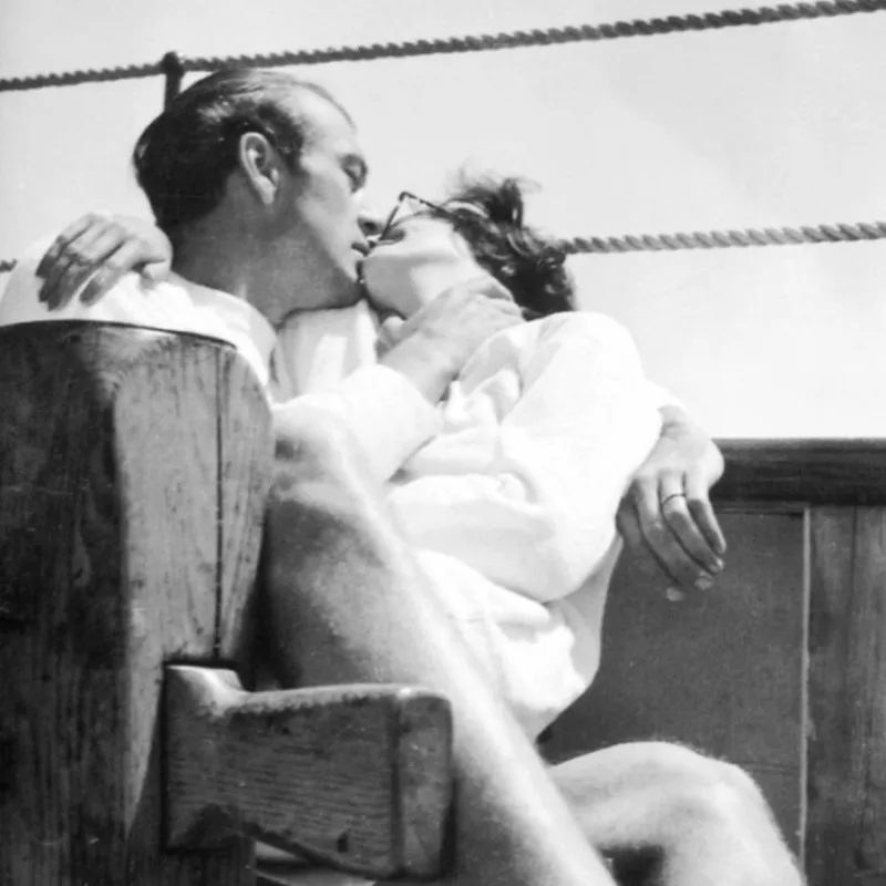 Couple kissing on pier