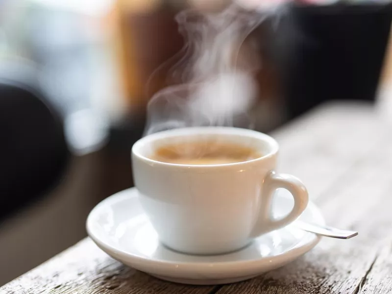 Refreshing hot cup of coffee at a cafe