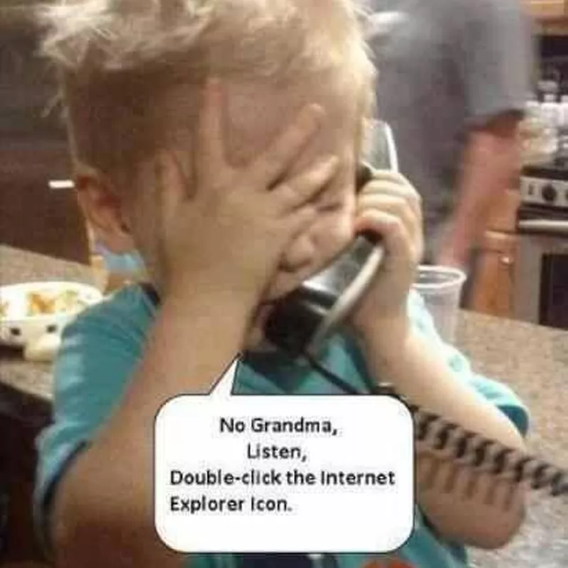 Baby teaching Grandma how to use a computer