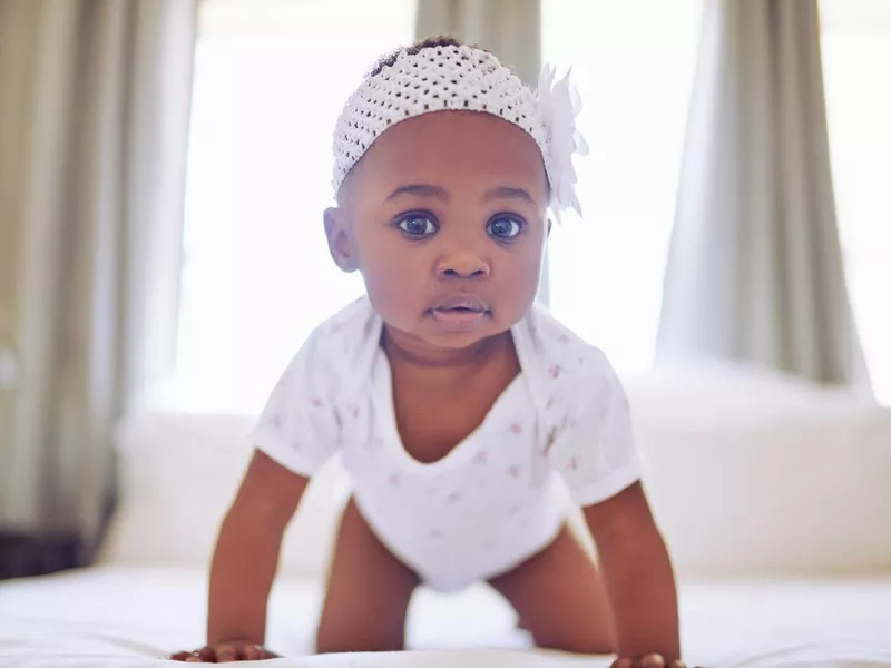 Young baby girl crawling