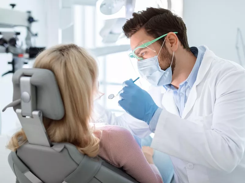 Dentist doing treatment on patient