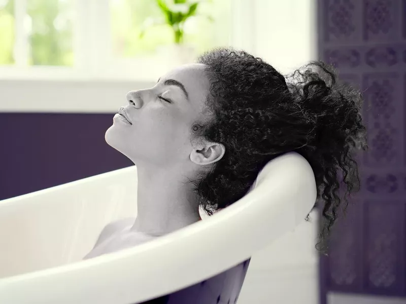 Woman having relaxing bath