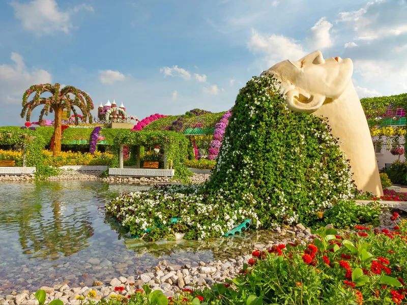 Female head decorated with flowers in Miracle Garden of Dubai.