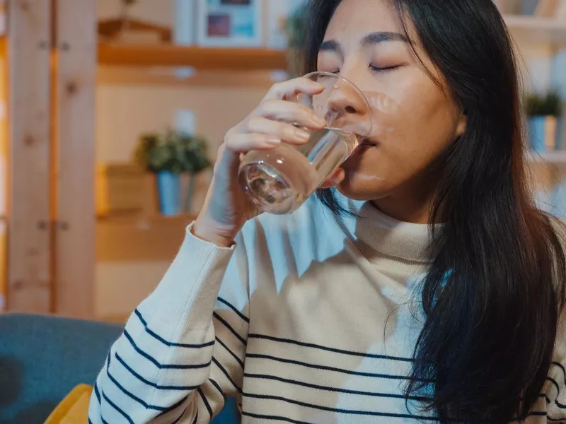 Young woman drinking water