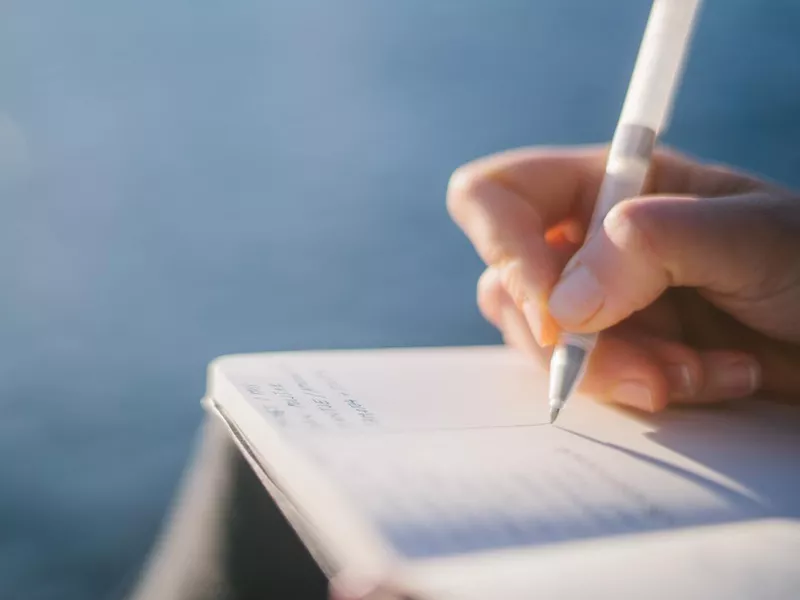 Young woman writing