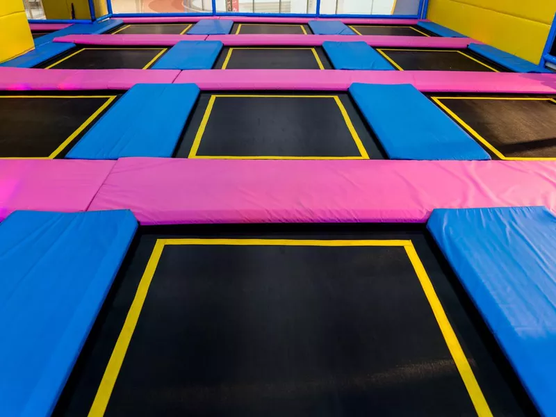 Big empty trampoline waiting for children, lean place