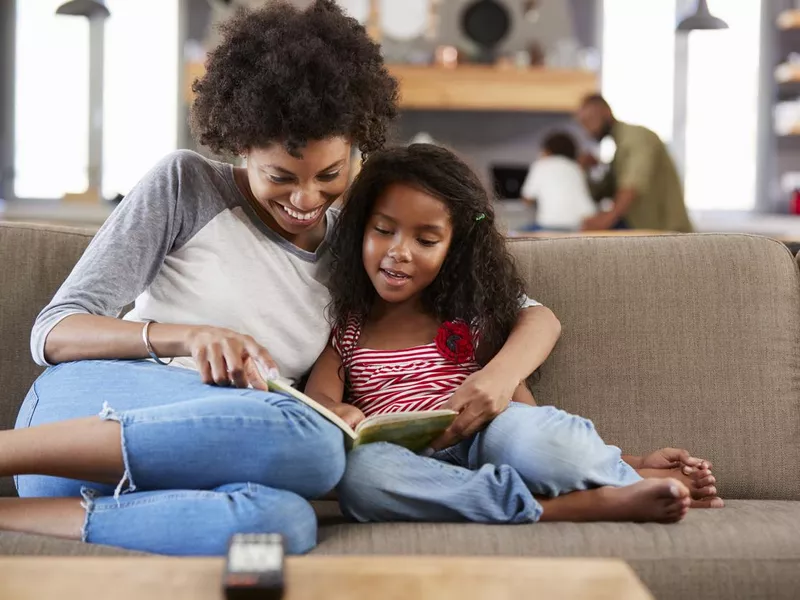 Mother and daughter reading together