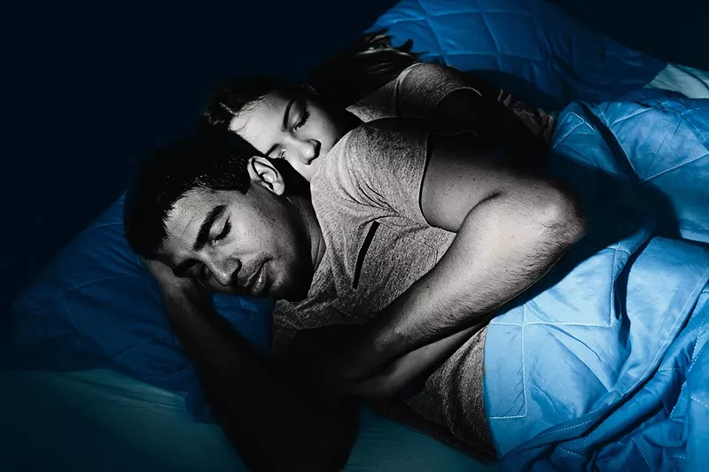 Couple sleeping in bed