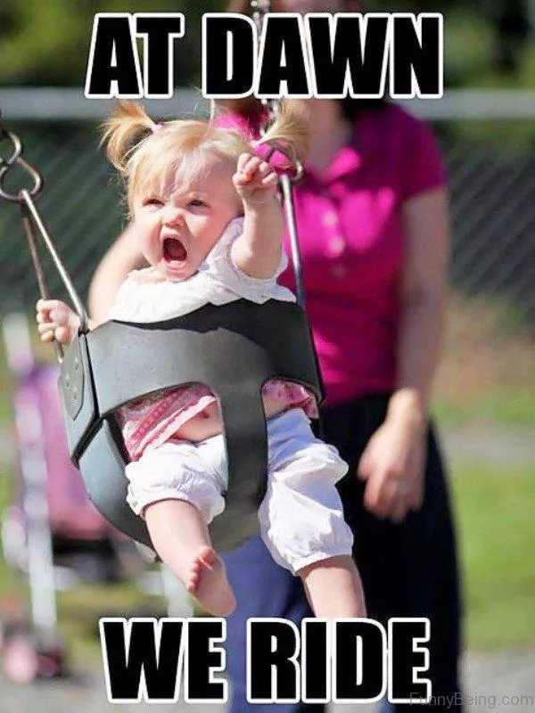 Funny baby in a swing