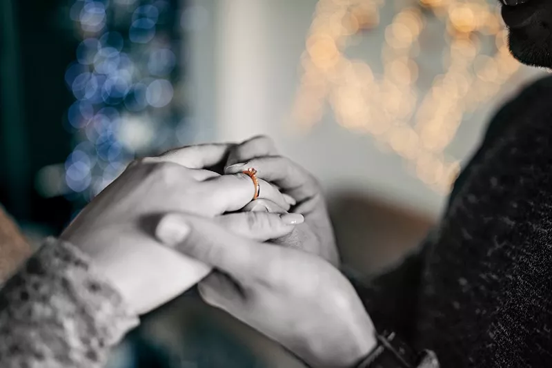 Young man is proposing to his girlfriend