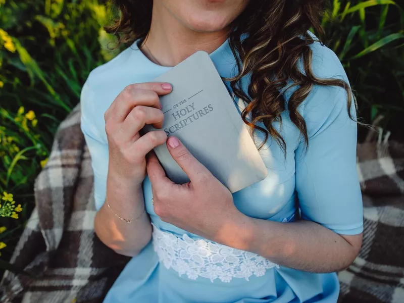 woman holding bible