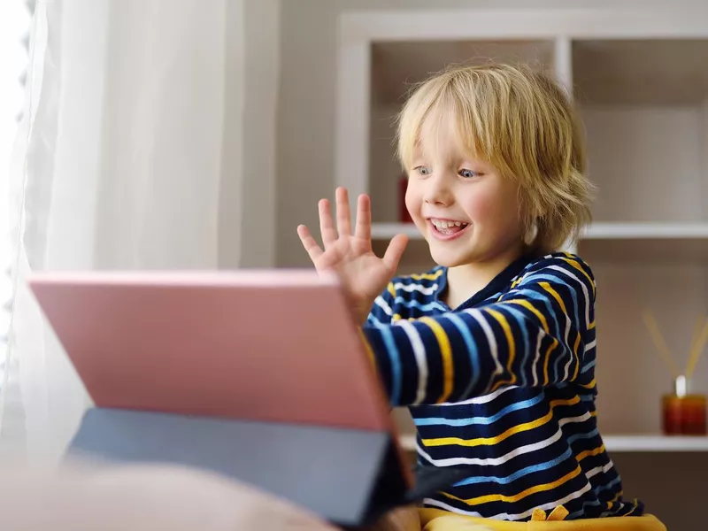 Little boy is meeting and talking in video chat