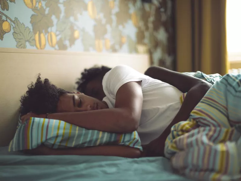 Young couple sleeping in bed