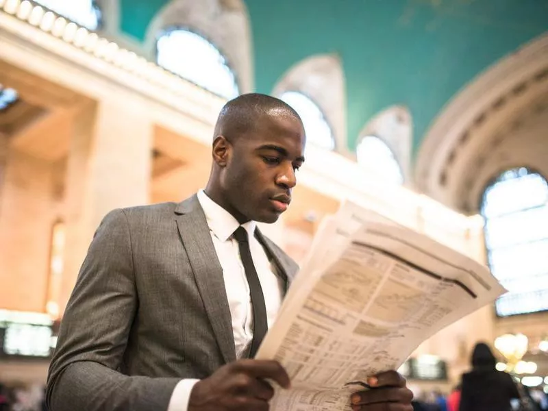 man reading newspaper