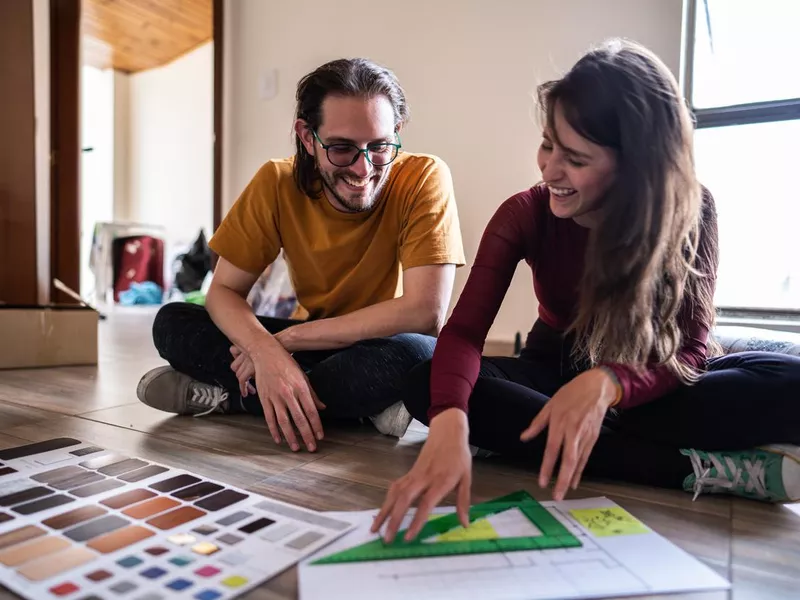 Couple talking while making decisions about the new apartment