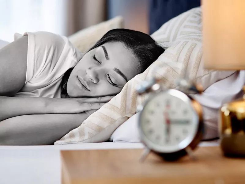 Shot of a young woman in bed at home