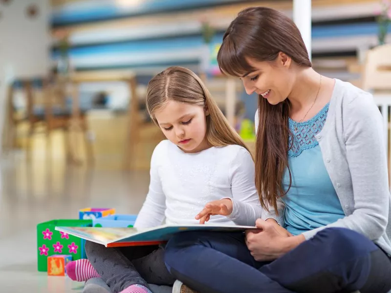 Mother and daughter reading together